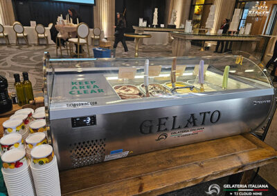 The back view of a gelato tabletop set up on a wooden table