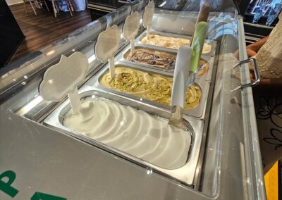 View of 4 flavours in a gelato tabletop with lid open