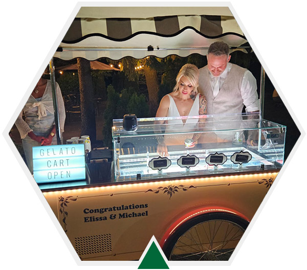 Bride and Groom standing behind Vintage Gelato Cart
