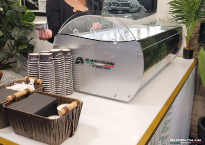Side view of the Gelato Tabletop with a basket of napkins and branded cups